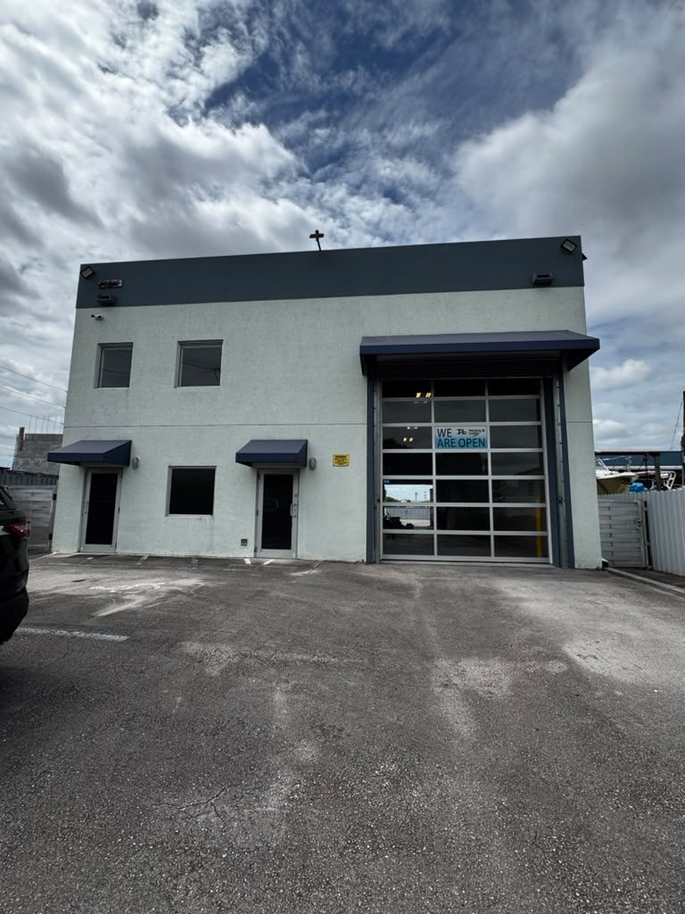 Front facade of the freestanding industrial building at 10810 NW 22 St, Doral